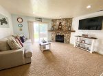 Family room with walk out patio and grassy area